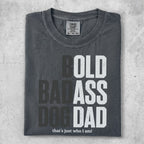 Charcoal t-shirt with "BOLD BADASS DOG DAD that's just who I am!" text.