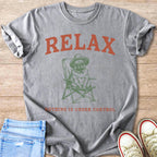 Gray t-shirt with "RELAX" in orange and a pug sitting in a chair.