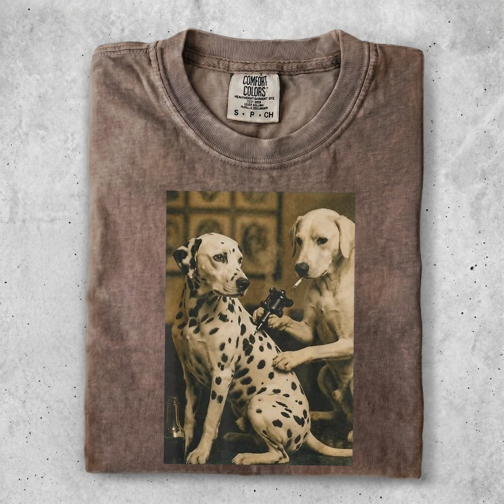 T-shirt with vintage print of a Dalmatian getting a tattoo from a Labrador.