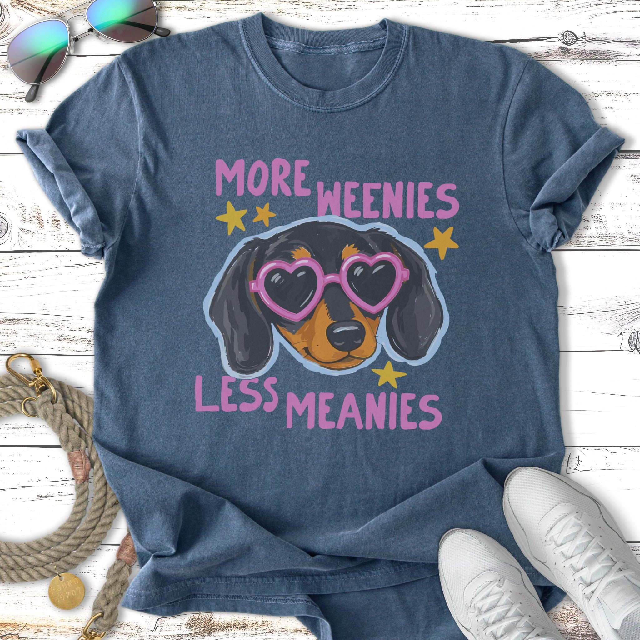 T-shirt with dachshund wearing heart sunglasses and text "More Weenies Less Meanies."