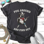 Dark t-shirt with a cartoon pug wearing a cowboy hat and holding a gun, text reads "PUG AROUND AND FIND OUT".