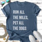 Blue t-shirt with white text "RUN ALL THE MILES, PET ALL THE DOGS".